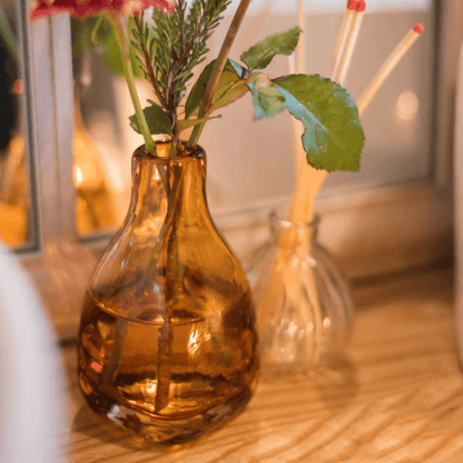 Amber handblown glass vase with greenery; two vases visible in background RusticReach on Tampa Home & Garden Store