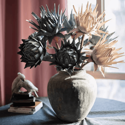 Artificial artichoke stems in gray and beige, 37 inches tall, arranged in a rustic ceramic vase on Tampa Home & Garden Store