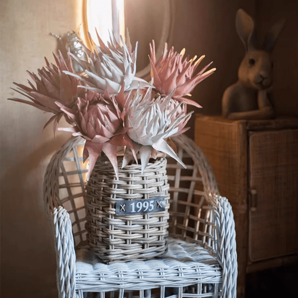 Artificial Artichoke Stem in pink and white, 37 in tall, RusticReach in a woven basket on Tampa Home & Garden Store