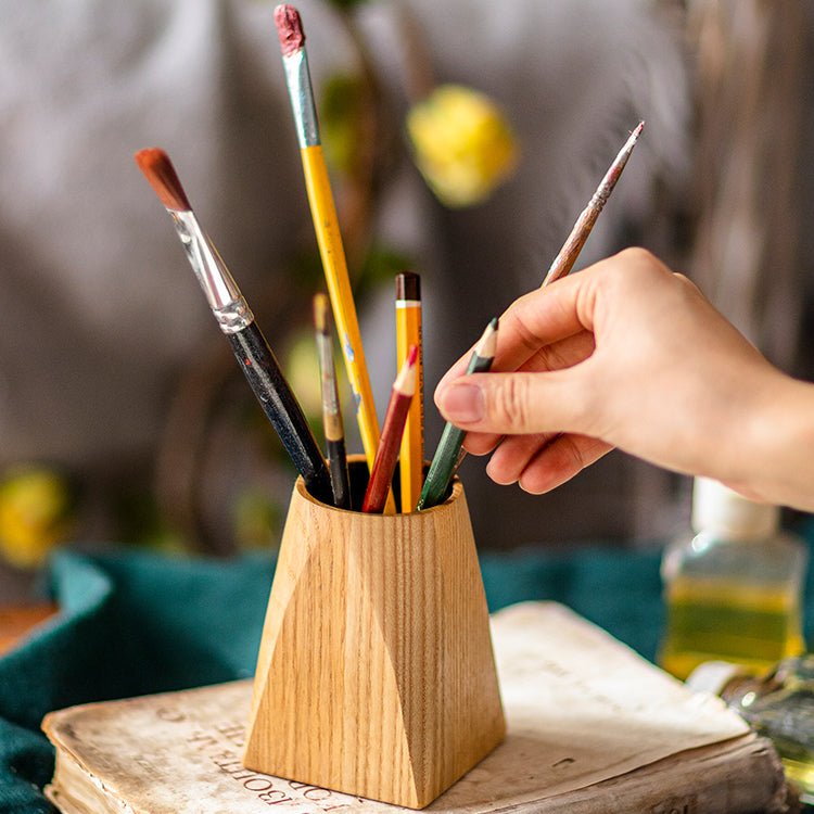 Ash wood desktop pen holder with natural finish; pyramid base holding brushes and pencils on Tampa Home & Garden Store