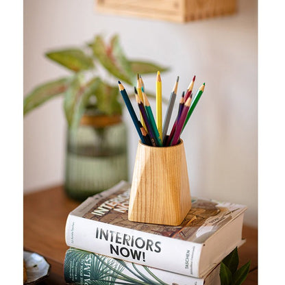 Ash wood desktop pen holder by RusticReach with colorful pencils on a stack of design books on Tampa Home & Garden Store