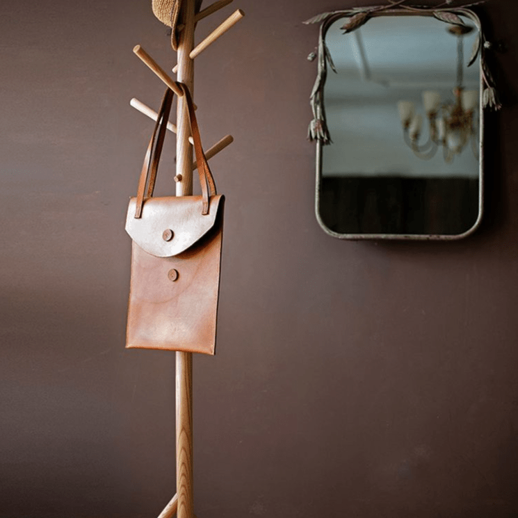 Ash Wood Coat Rack by RusticReach with brown leather bag on a brown wall near a vintage mirror on Tampa Home & Garden Store