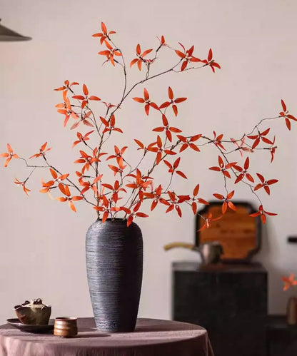 Autumn Pomegranate Leaf Stem artificial plant in a tall dark vase with orange leaves on Tampa Home & Garden Store