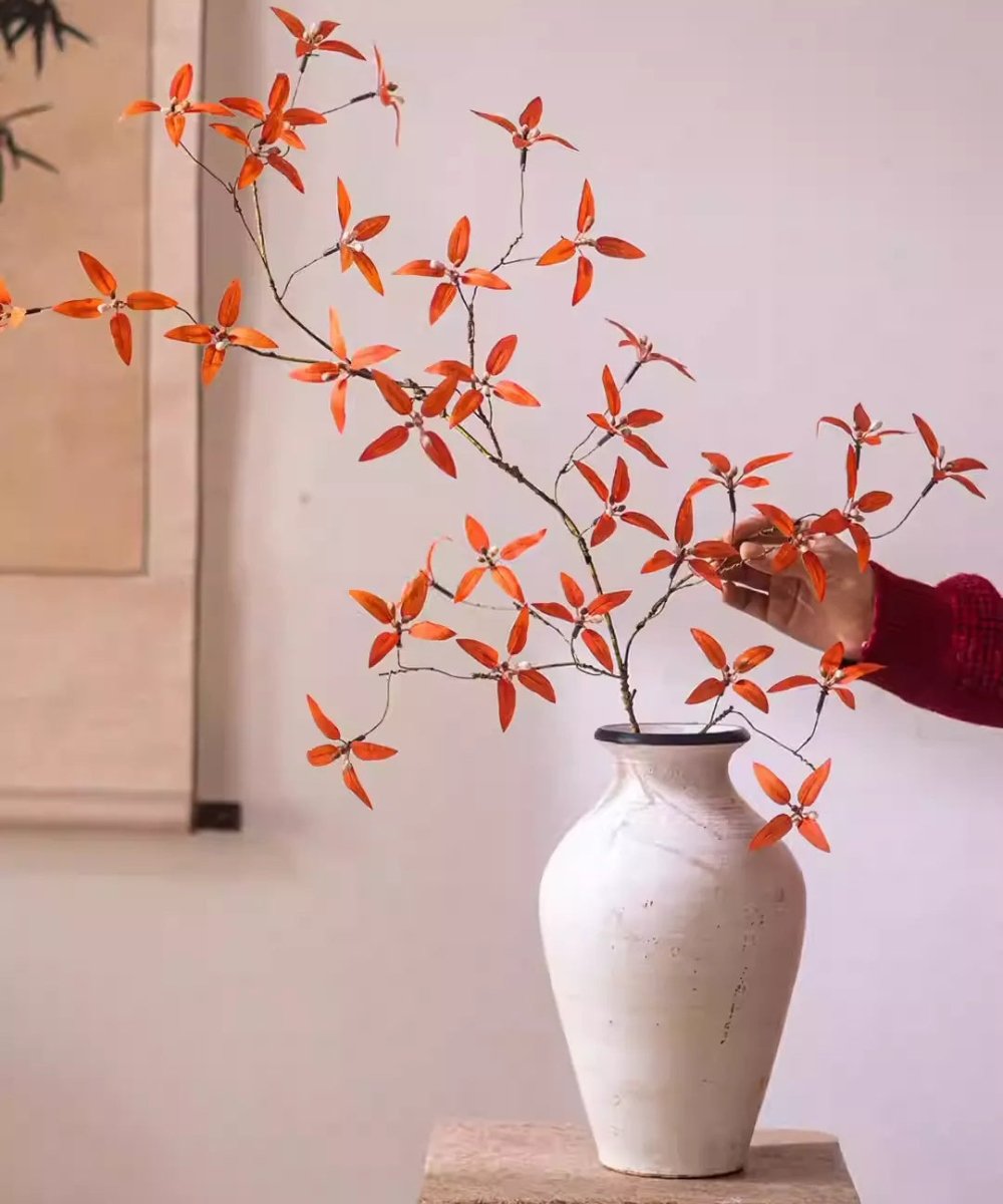 Autumn Pomegranate Leaf Stem by RusticReach orange artificial foliage in a white ceramic vase on Tampa Home & Garden Store