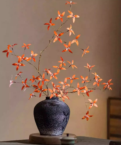 Autumn Pomegranate Leaf Stem by RusticReach; orange artificial leaves in a textured black vase on Tampa Home & Garden Store