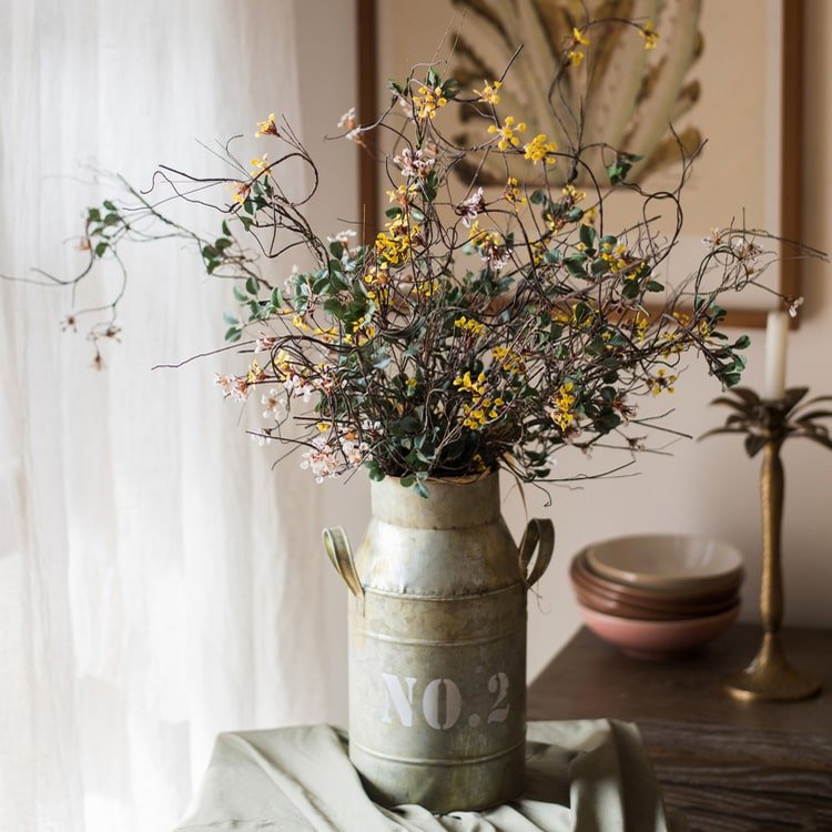 RusticReach baby's-breath vine stem, 27 in tall, yellow-pink blooms in metal milk-can vase on Tampa Home & Garden Store