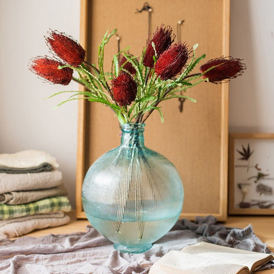 RusticReach Faux Banksia Integrifolia Silk Flower, red-brown bottlebrush blooms in a blue glass vase on Tampa Home & Garden Store