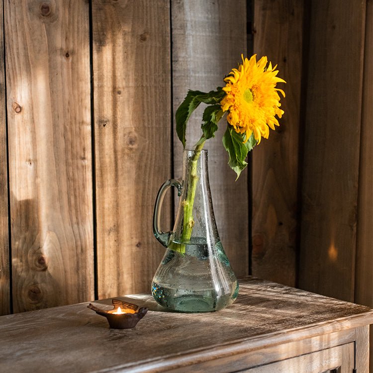 RusticReach bubble glass kettle vase with handle holding a sunflower on table with a candle on Tampa Home & Garden Store