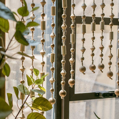 Wood beaded door curtain RusticReach with natural beige wood beads, few bead strands by window on Tampa Home & Garden Store