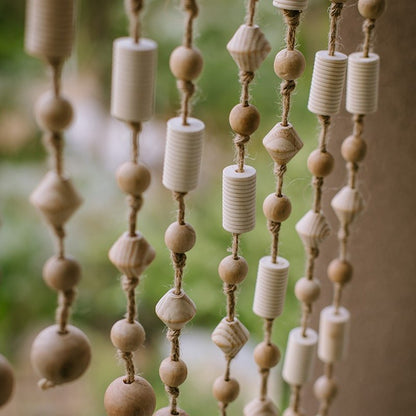 Wood beaded door curtain with natural wood beads in cylindrical and round shapes on jute strands on Tampa Home & Garden Store