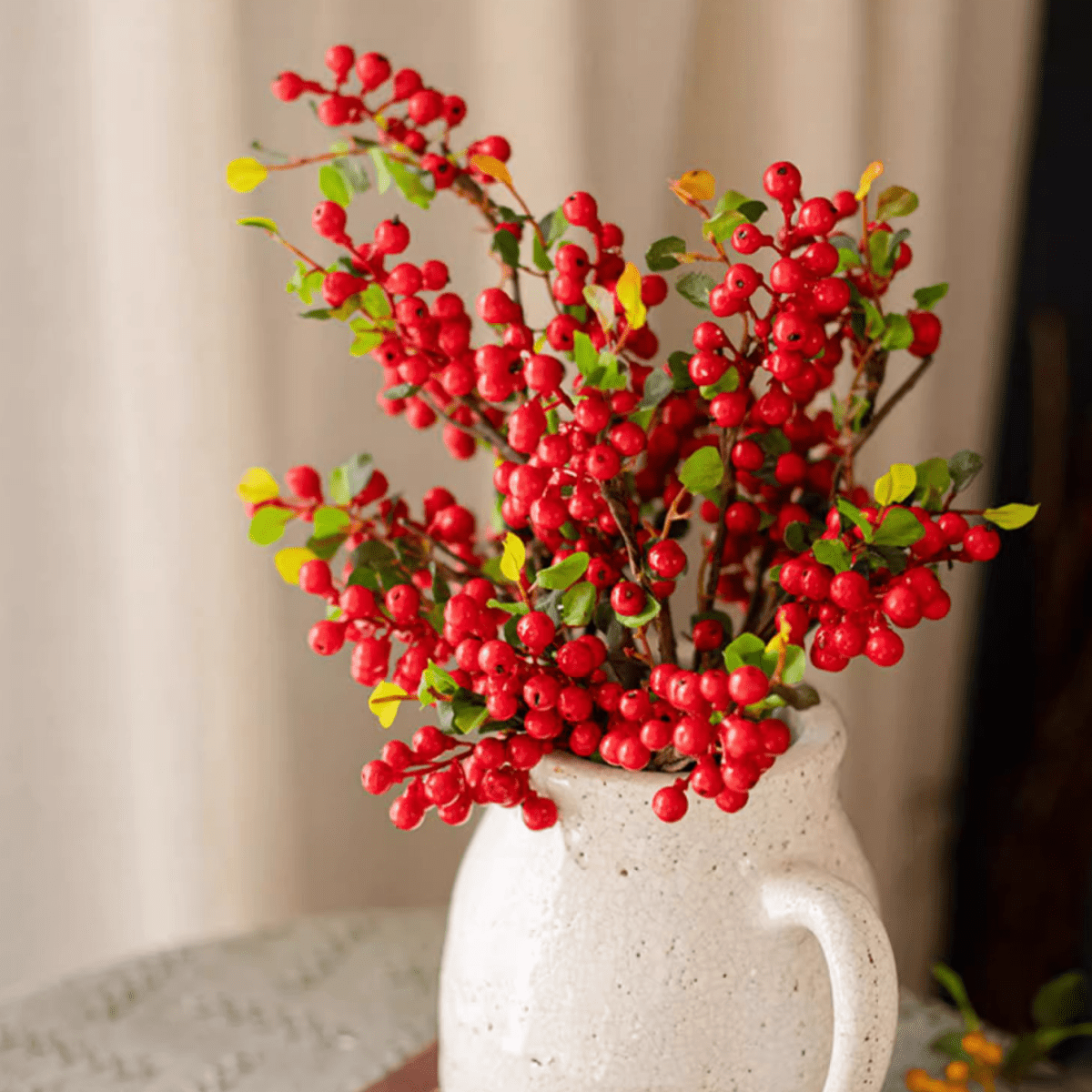 Artificial berry stem with red berries, 17" tall silk plant in a white pitcher on Tampa Home & Garden Store