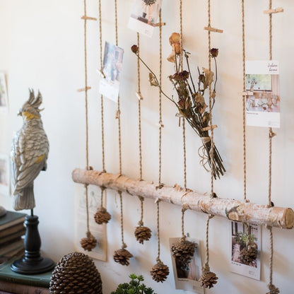 Birch Wood Photo Wall Hanger by RusticReach, rope-hung with clips and pinecone decor on Tampa Home & Garden Store