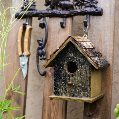 Birch Wood Decorative Bird House by RusticReach, weathered bark exterior, hanging on fence on Tampa Home & Garden Store
