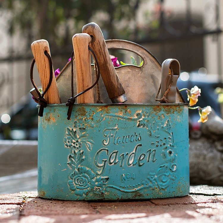 Blue metal basket tool organizer with wooden-handled garden tools RusticReach on Tampa Home & Garden Store