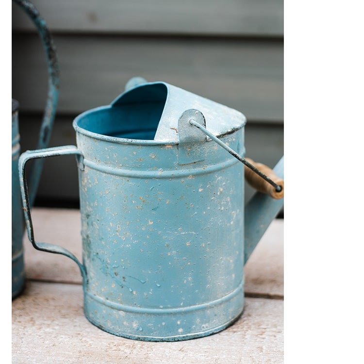 Blue metal rustic watering can by RusticReach with weathered finish on Tampa Home & Garden Store