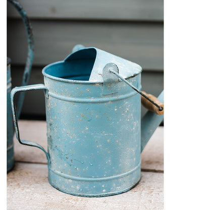 Blue metal rustic watering can by RusticReach with weathered finish on Tampa Home & Garden Store