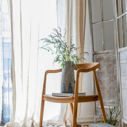 One blue handpainted terracotta vase by RusticReach on a wooden chair with greenery on Tampa Home & Garden Store