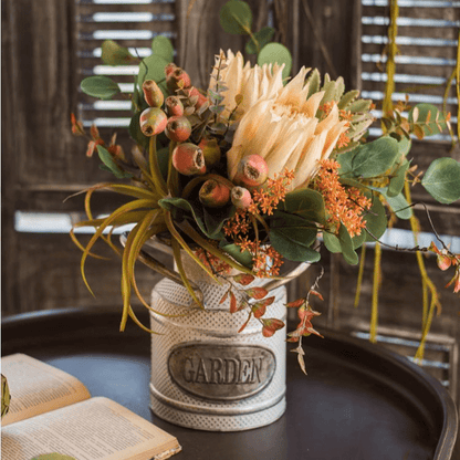 Mountian Oriole King Protea bouquet by RusticReach in a perforated metal vase with eucalyptus on Tampa Home & Garden Store