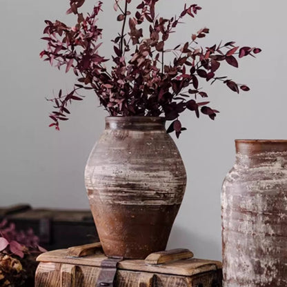 Restoration Brown Clay Pot with rustic finish and burgundy foliage stems on weathered crates on Tampa Home & Garden Store