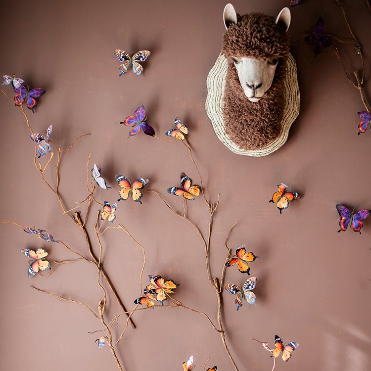 Butterfly clips set of 5 randomly picked in assorted colors on twig display on Tampa Home & Garden Store