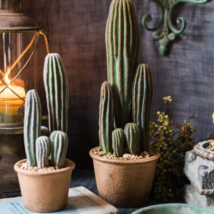 Artificial faux cactus in two brown pots with tall and small green cacti and pebbled soil on Tampa Home & Garden Store