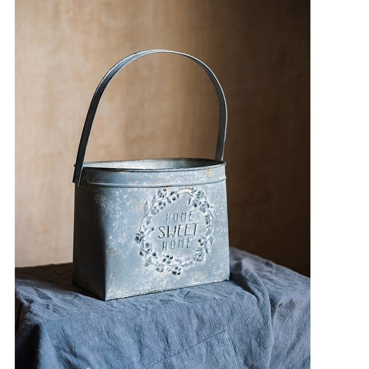 Iron Carry Flower Pot gray with embossed wreath and Home Sweet Home text, metal handle on Tampa Home & Garden Store