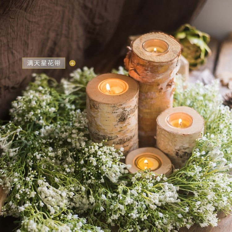 Birch Wood Candle Holders in varied sizes with tea lights among baby's breath on Tampa Home & Garden Store