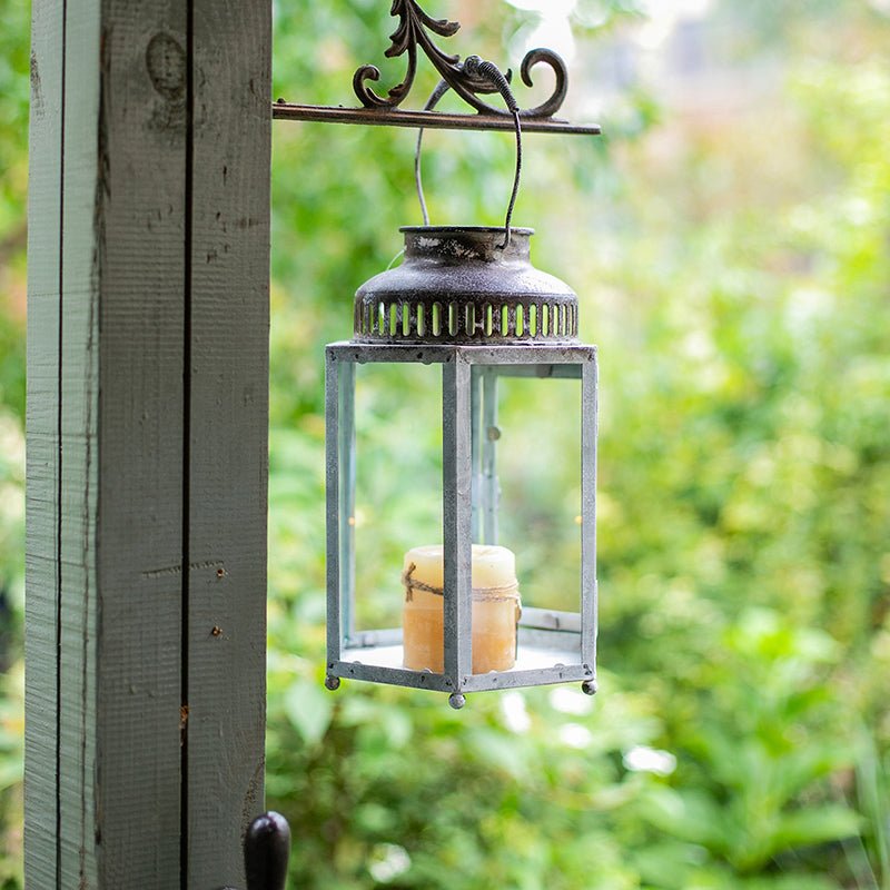 Glass metal lantern candle holder by RusticReach, weathered gray frame with glass panels on Tampa Home & Garden Store