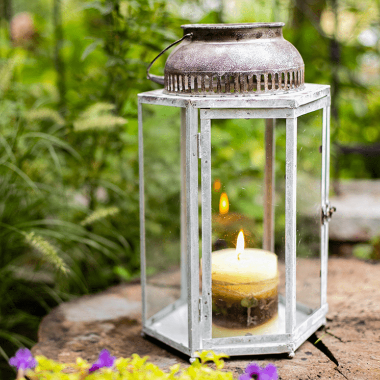 Glass Metal Lantern Candle Holder RusticReach weathered metal frame with glass panes, lit candle on Tampa Home & Garden Store