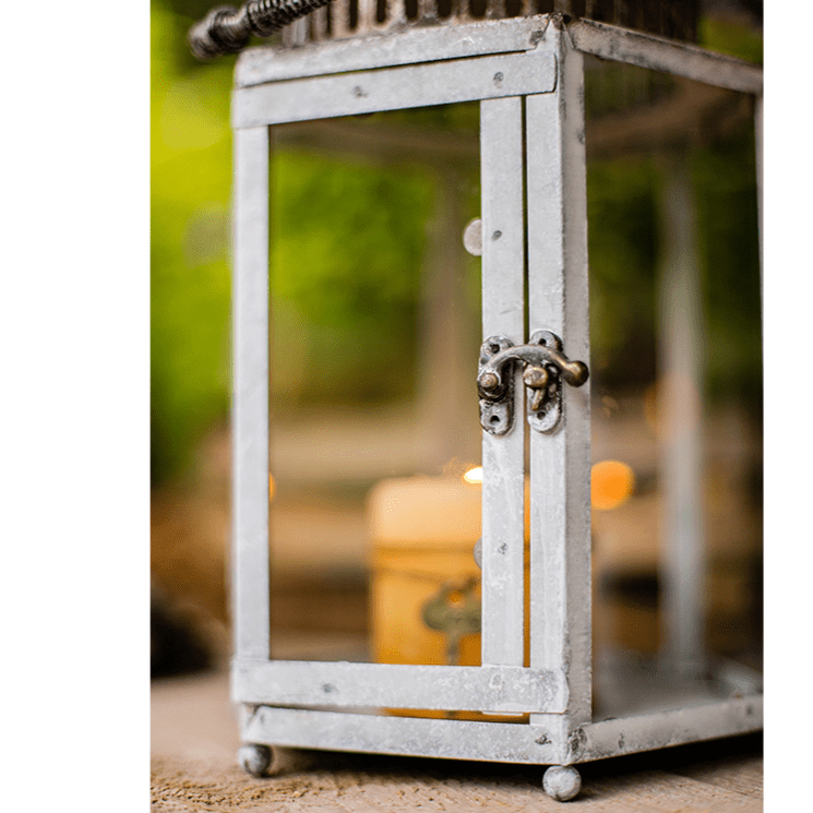 Glass metal lantern candle holder in distressed gray with glass panels on Tampa Home & Garden Store