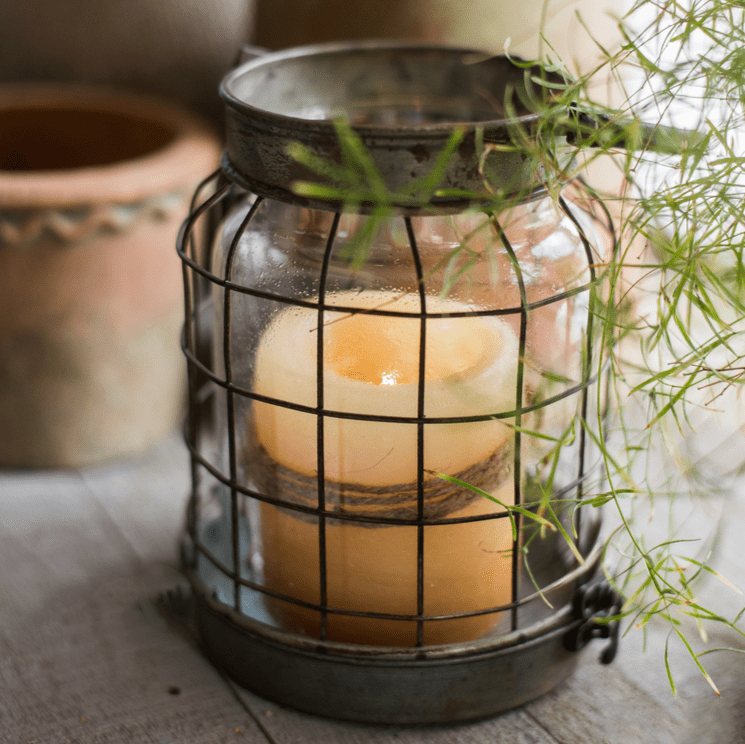 European Restoration Candle Holder by RusticReach, bronze cage over glass jar with candle on Tampa Home & Garden Store