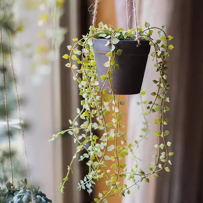 Hanging faux Ceropegia vine in black pot by RusticReach with trailing green leaves on Tampa Home & Garden Store