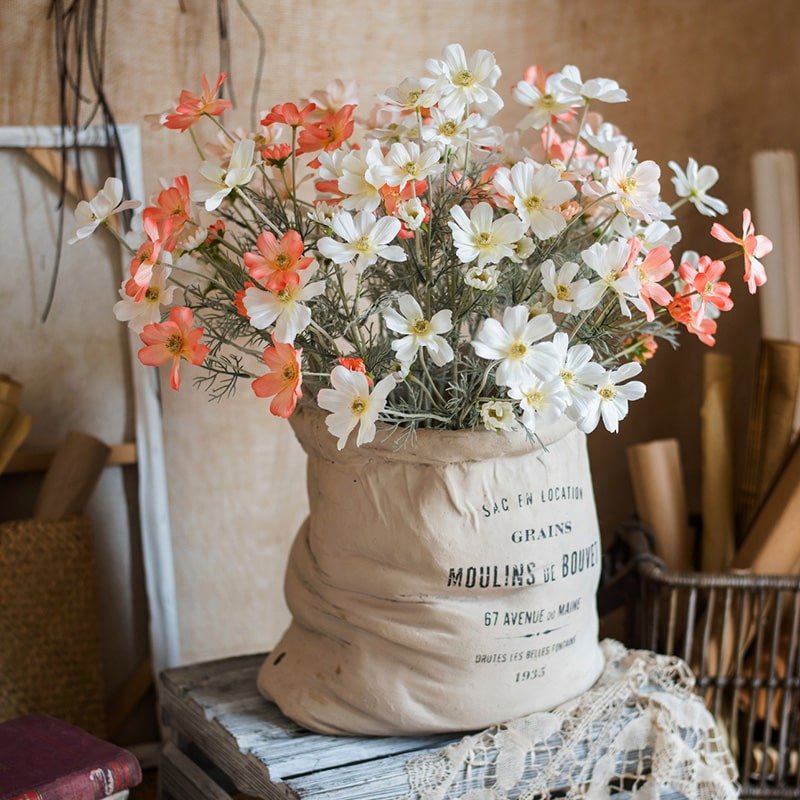 RusticReach faux silk cosmos stems orange and white blooms 24 in tall in a beige sack planter on Tampa Home & Garden Store