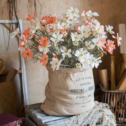 RusticReach faux silk cosmos stems orange and white blooms 24 in tall in a beige sack planter on Tampa Home & Garden Store