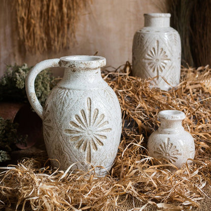 Three white ceramic vases with a carved floral motif in rustic glaze, RusticReach on Tampa Home & Garden Store