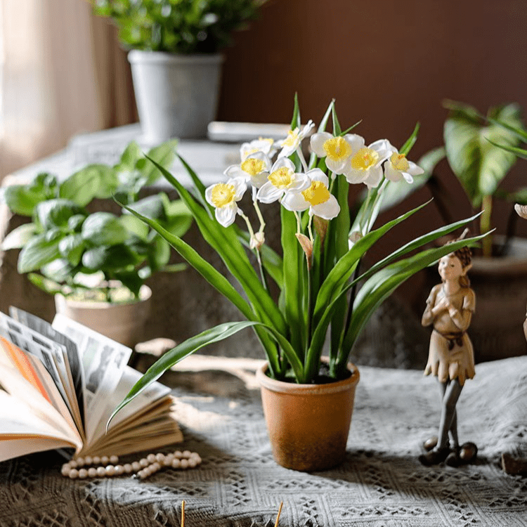 Faux Daffodil in Brown Pot by RusticReach with white petals and yellow centers on a table on Tampa Home & Garden Store