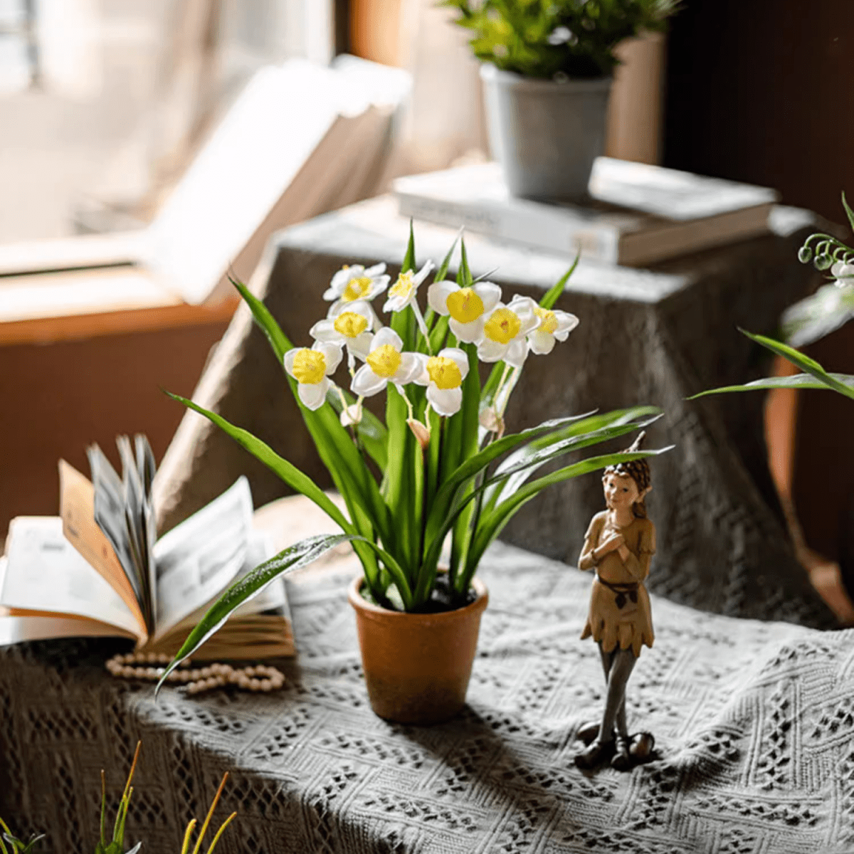 Faux Daffodil in brown pot with white petals and yellow centers on a tabletop display on Tampa Home & Garden Store
