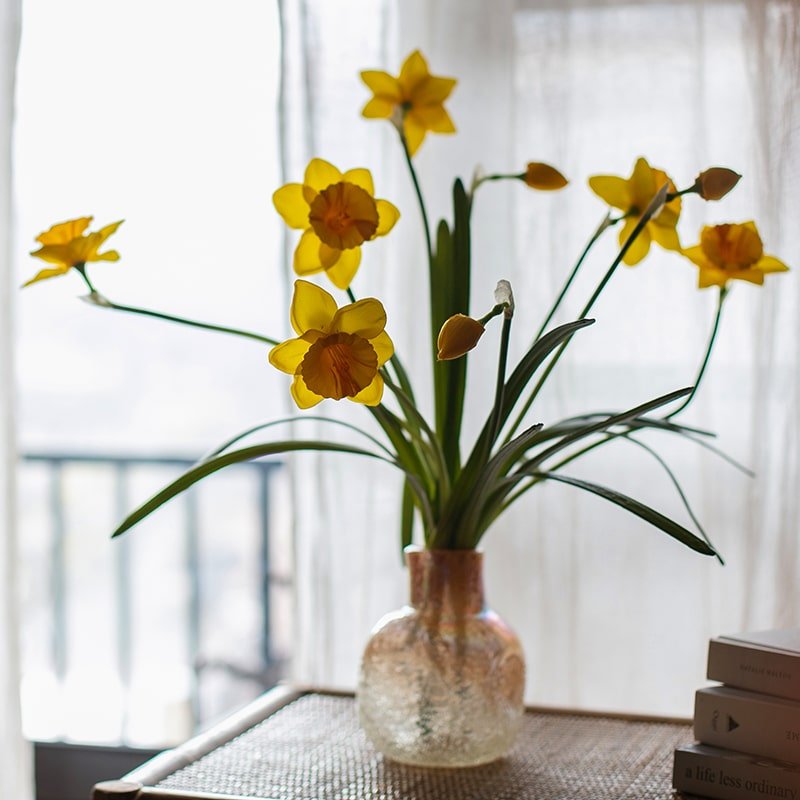 Artificial silk yellow daffodil stem 19in tall with green leaves in a glass vase on Tampa Home & Garden Store