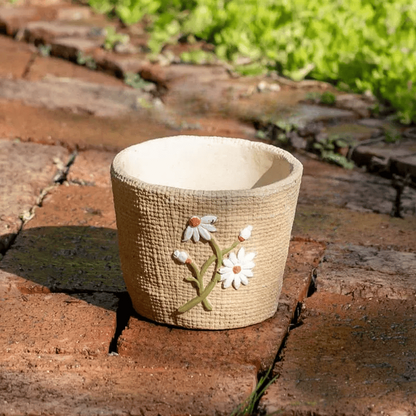 Daisy Garden Cement Planter by RusticReach; beige textured cement pot with embossed daisies on Tampa Home & Garden Store