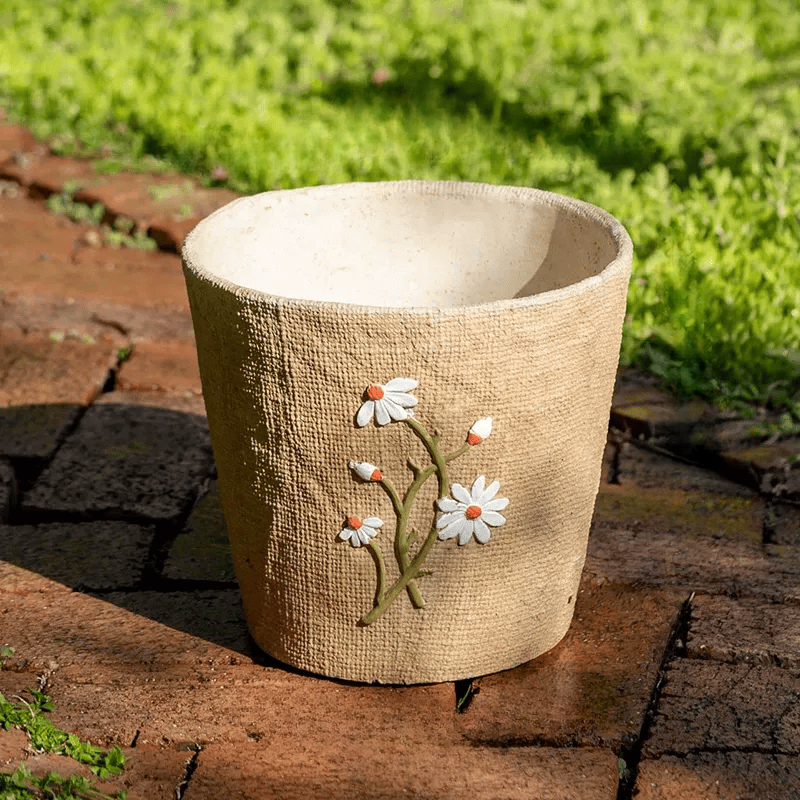 Daisy Garden Cement Planter by RusticReach with beige textured exterior and white daisy relief on Tampa Home & Garden Store
