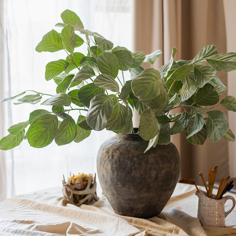 Faux Large Dans Leaf Stem Plant RusticReach, large green leaves in a dark ceramic vase on Tampa Home & Garden Store