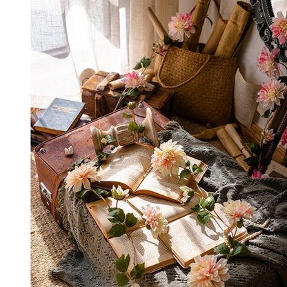 Artificial Dahlia Flower Vine 59 long draped over open book on vintage leather suitcase on Tampa Home & Garden Store
