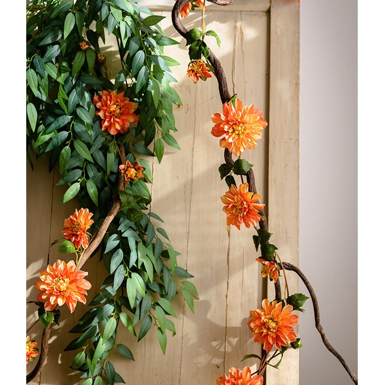Artificial dahlia flower vine 59-inch long with orange blooms and green foliage on a brown stem on Tampa Home & Garden Store