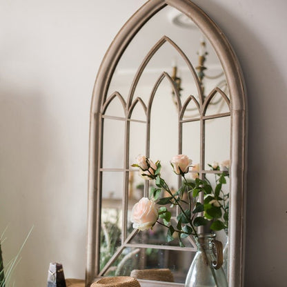 Rustic French Art Mirror with a cathedral arch frame and pale pink roses in a metal pitcher on Tampa Home & Garden Store