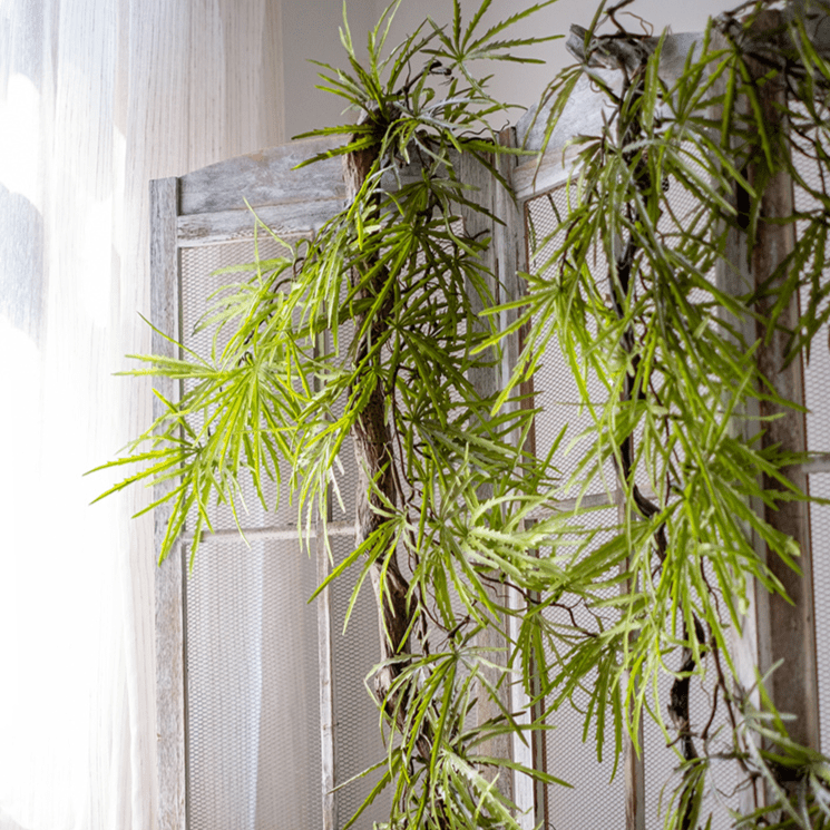 Artificial Ferns Vine Stem 39-inch long with bright green slender leaves over RusticReach screen on Tampa Home & Garden Store