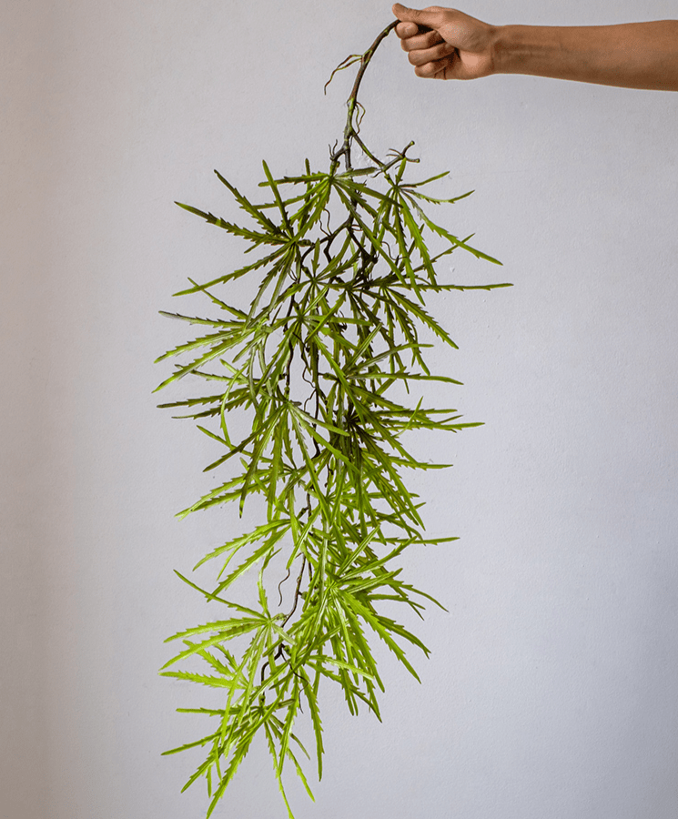 Artificial Ferns Vine Stem 39-inch Long in bright green plastic, RusticReach, held by hand on Tampa Home & Garden Store