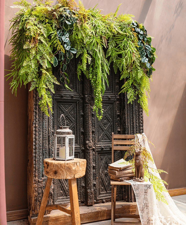 Artificial Ferns Vine Stem 39 inches long with cascading green leaves over a cabinet on Tampa Home & Garden Store