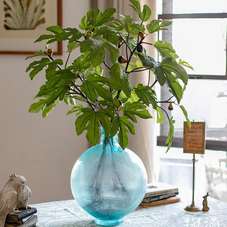 Artificial Faux Fig Leaf Stem RusticReach in a blue ribbed glass vase with green fig leaves on Tampa Home & Garden Store