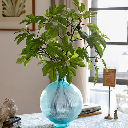 Artificial Faux Fig Leaf Stem RusticReach in a blue ribbed glass vase with green fig leaves on Tampa Home & Garden Store