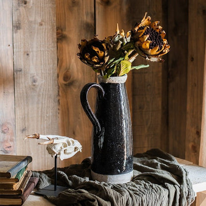 Artificial Flannel Sunflower Stem in a dark blue ceramic pitcher on a rustic wooden table on Tampa Home & Garden Store